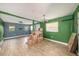 Spacious open-concept area featuring wood-look tile floors, neutral walls, and natural light at 8606 N 9Th St, Tampa, FL 33604