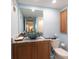 Stylish bathroom featuring a marble countertop, unique bowl sink, and modern fixtures at 11000 Gulf Blvd # 1004, Treasure Island, FL 33706