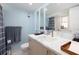 Well-lit bathroom featuring a marble countertop, modern fixtures, and a shower/tub combination at 11000 Gulf Blvd # 1004, Treasure Island, FL 33706