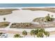 Stunning aerial view of the beach, showcasing the expansive sandy shores and beautiful ocean scenery at 11000 Gulf Blvd # 1004, Treasure Island, FL 33706
