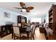 Well-lit dining area with a dark wood table, comfortable seating, and access to the living room and kitchen at 11000 Gulf Blvd # 1004, Treasure Island, FL 33706