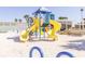 Community playground area featuring slides and play structures near the beach at 11000 Gulf Blvd # 1004, Treasure Island, FL 33706