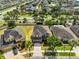 Beautiful aerial shot of homes with green lawns, mature trees, and well-maintained landscaping at 11044 Spring Point Cir, Riverview, FL 33579