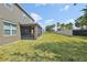 Expansive backyard with screened-in porch, providing ample space for recreation at 11044 Spring Point Cir, Riverview, FL 33579