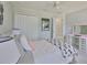 Comfortable bedroom with gray walls, a double door closet, vanity table, and soft carpet flooring at 11044 Spring Point Cir, Riverview, FL 33579
