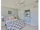 Cozy bedroom featuring neutral walls, a comfortable bed, and ample closet space for storage at 11044 Spring Point Cir, Riverview, FL 33579