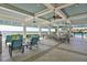 The open-air clubhouse is the perfect spot for lakeside lounging and dining at 11044 Spring Point Cir, Riverview, FL 33579