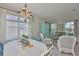 Cozy dining area featuring a rustic chandelier and stylish decor perfect for Gathering meals at 11044 Spring Point Cir, Riverview, FL 33579