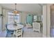 Bright dining space with a large window and elegant lighting at 11044 Spring Point Cir, Riverview, FL 33579