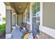 Relaxing front porch offers comfortable seating and picturesque views at 11044 Spring Point Cir, Riverview, FL 33579
