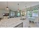 Kitchen island with granite countertops, stainless steel appliances, and bar seating at 11044 Spring Point Cir, Riverview, FL 33579