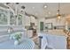 Kitchen view featuring granite countertops, white cabinetry, stainless steel appliances and an island with bar seating at 11044 Spring Point Cir, Riverview, FL 33579