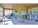 Inviting screened lanai with comfortable seating and an outdoor dining area for relaxing and entertaining at 11044 Spring Point Cir, Riverview, FL 33579
