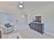 Bright living room features plush carpet, neutral walls, modern furniture, and a ceiling fan at 11044 Spring Point Cir, Riverview, FL 33579
