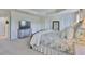 Well-lit main bedroom with tray ceilings, ample closet space, soft carpet, and serene décor for a relaxing retreat at 11044 Spring Point Cir, Riverview, FL 33579