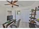 Well-lit home office featuring carpet flooring, and bright natural light from the entry way at 11044 Spring Point Cir, Riverview, FL 33579