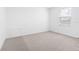 Clean and bright bedroom with carpeting and a window for natural light at 11047 Flycatcher Rd, Brooksville, FL 34614