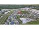 Aerial view shows community with houses, green spaces, and street layouts at 11295 Timber Grove Ln, Brooksville, FL 34613