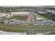 Large aerial view of community features well-maintained homes with organized street layouts amid green surroundings at 11295 Timber Grove Ln, Brooksville, FL 34613