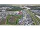 Wide aerial view showcases homes nestled within a thoughtfully planned community and surrounding landscape at 11295 Timber Grove Ln, Brooksville, FL 34613
