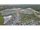 Aerial view showcases a residential community with organized street grids and attractive housing layouts at 11295 Timber Grove Ln, Brooksville, FL 34613