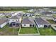 Aerial view of a home with a screened-in porch and fenced backyard providing an ideal outdoor living space at 11295 Timber Grove Ln, Brooksville, FL 34613