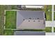 Aerial view of a home's roof and fenced backyard, featuring well-maintained landscaping and privacy at 11295 Timber Grove Ln, Brooksville, FL 34613