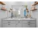 Bright bathroom features double sinks, granite countertops, and a walk-in shower at 11295 Timber Grove Ln, Brooksville, FL 34613