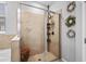 Beautiful bathroom features an enclosed glass shower with a built-in shower rack at 11295 Timber Grove Ln, Brooksville, FL 34613