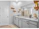 Bright bathroom features double sinks, granite countertops, and a walk-in shower at 11295 Timber Grove Ln, Brooksville, FL 34613