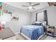 Bedroom with ceiling fan, tiled floors, and lots of toys on display at 11295 Timber Grove Ln, Brooksville, FL 34613