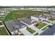 Aerial view of a home with beautifully landscaped yard, a modern design, and a welcoming neighborhood at 11295 Timber Grove Ln, Brooksville, FL 34613