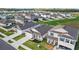 Aerial view of a well-maintained home featuring a manicured lawn, complementing the neighborhood's landscaping at 11295 Timber Grove Ln, Brooksville, FL 34613