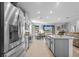 Bright kitchen with stainless steel appliances, granite counters, and center island at 11295 Timber Grove Ln, Brooksville, FL 34613