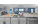 Granite island in open kitchen flowing to living room at 11295 Timber Grove Ln, Brooksville, FL 34613