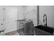 Laundry room with updated washer and dryer units and utility sink at 11295 Timber Grove Ln, Brooksville, FL 34613