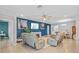 Spacious living room featuring comfortable seating, ceiling fan, and modern decor at 11295 Timber Grove Ln, Brooksville, FL 34613