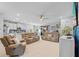Open-concept living area with large sofas, modern TV, and access to patio at 11295 Timber Grove Ln, Brooksville, FL 34613