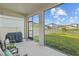 Relaxing covered patio with an outdoor seating area and beautiful backyard views at 11295 Timber Grove Ln, Brooksville, FL 34613