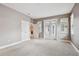 Neutral bedroom with closet, ensuite access, and sliding glass door at 11317 Wickersley Pl, Tampa, FL 33625