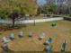Aerial view of a fenced dog park featuring chairs, play structures and artificial turf, ideal for pets and their owners at 11317 Wickersley Pl, Tampa, FL 33625