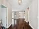 Elegant entryway featuring gleaming hardwood floors and an open floor plan with neutral walls at 11317 Wickersley Pl, Tampa, FL 33625