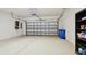 Spacious two car garage with speckled flooring at 11317 Wickersley Pl, Tampa, FL 33625