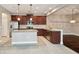 Kitchen with granite countertops, stainless steel appliances, and a large island at 11317 Wickersley Pl, Tampa, FL 33625