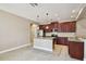 Kitchen with a granite island, stainless steel appliances, and ample cabinet space at 11317 Wickersley Pl, Tampa, FL 33625