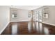 Spacious living area with hardwood floors, neutral walls, and bright natural light at 11317 Wickersley Pl, Tampa, FL 33625