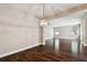 Bright living room with hardwood floors and an elegant chandelier at 11317 Wickersley Pl, Tampa, FL 33625
