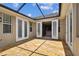 A covered brick patio leading indoors at 11317 Wickersley Pl, Tampa, FL 33625