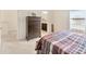 Bedroom with a large window, dresser and an ensuite bathroom with dual vanity at 12710 Buffalo Run Drive, Gibsonton, FL 33534