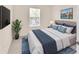 Comfortable bedroom showcasing a queen bed, neutral color palette, and stylish décor at 12710 Buffalo Run Drive, Gibsonton, FL 33534